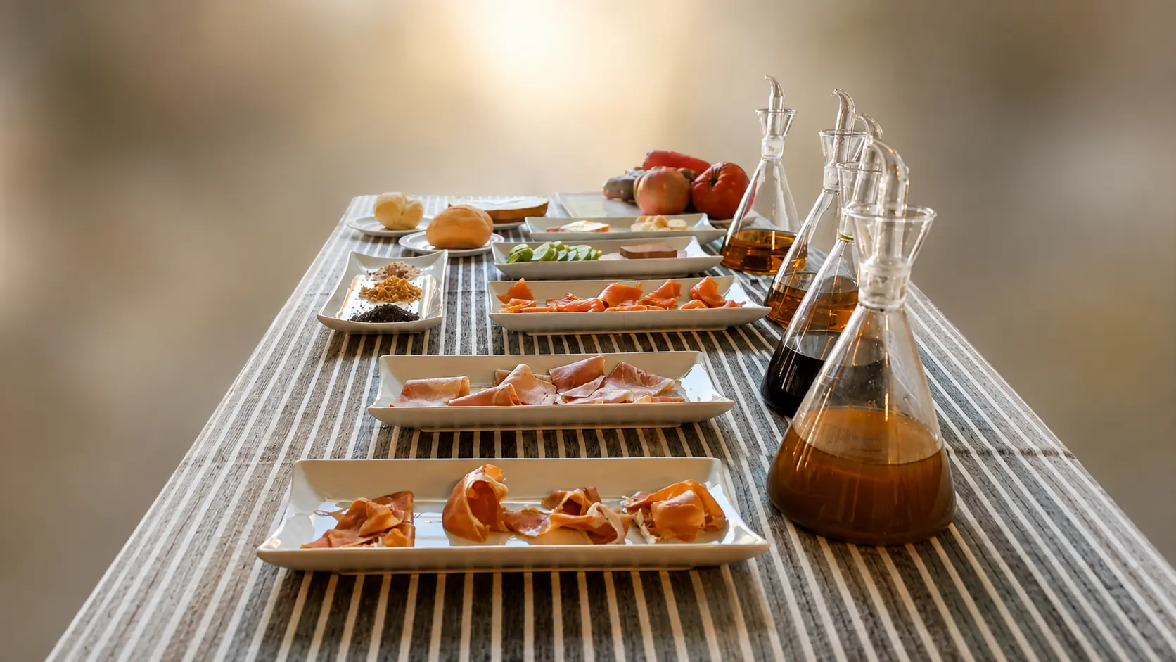 Mesa preparada para la experiencia Rocío y Aromas con aceites y alimentos seleccionados